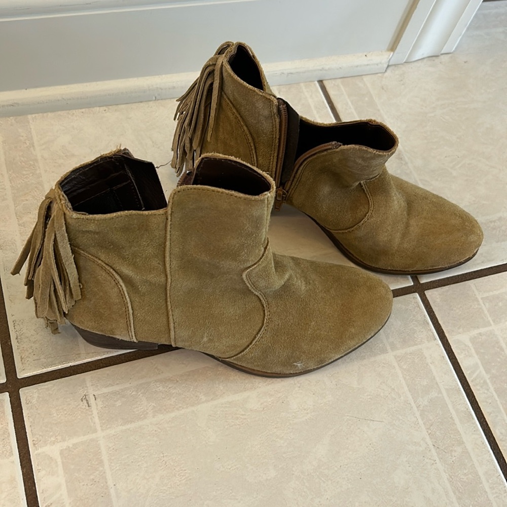Tan suede books with fringe in back